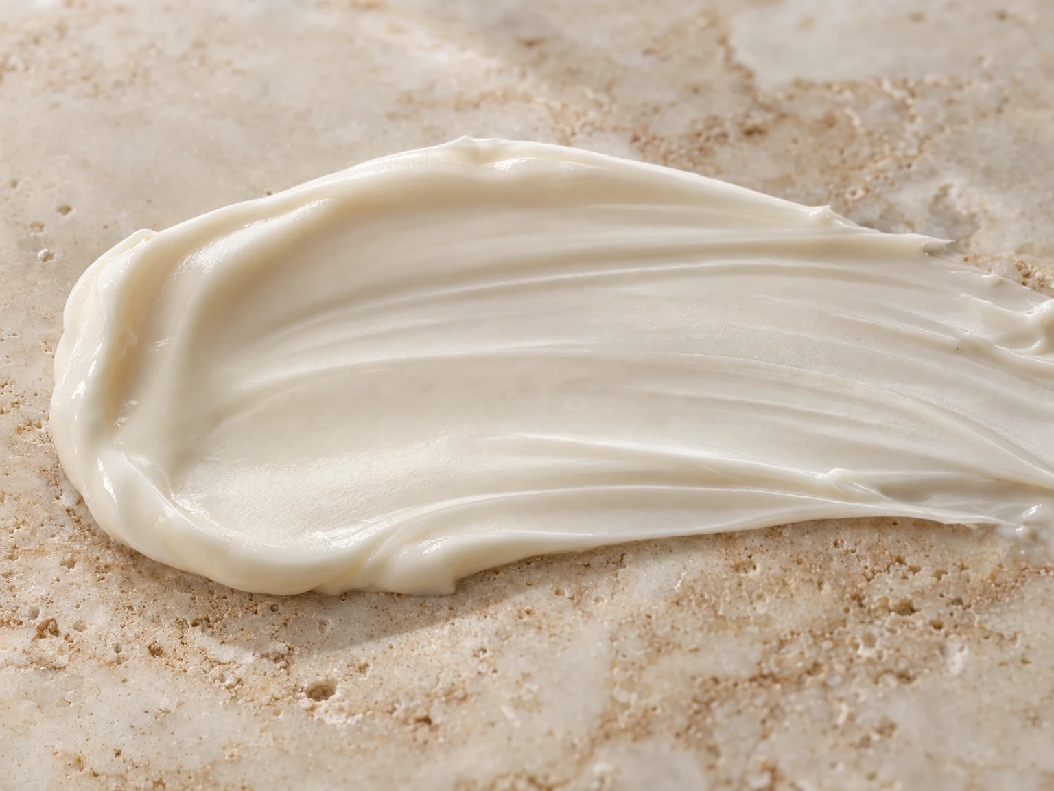 A swipe of the rich ivory cream on stone
